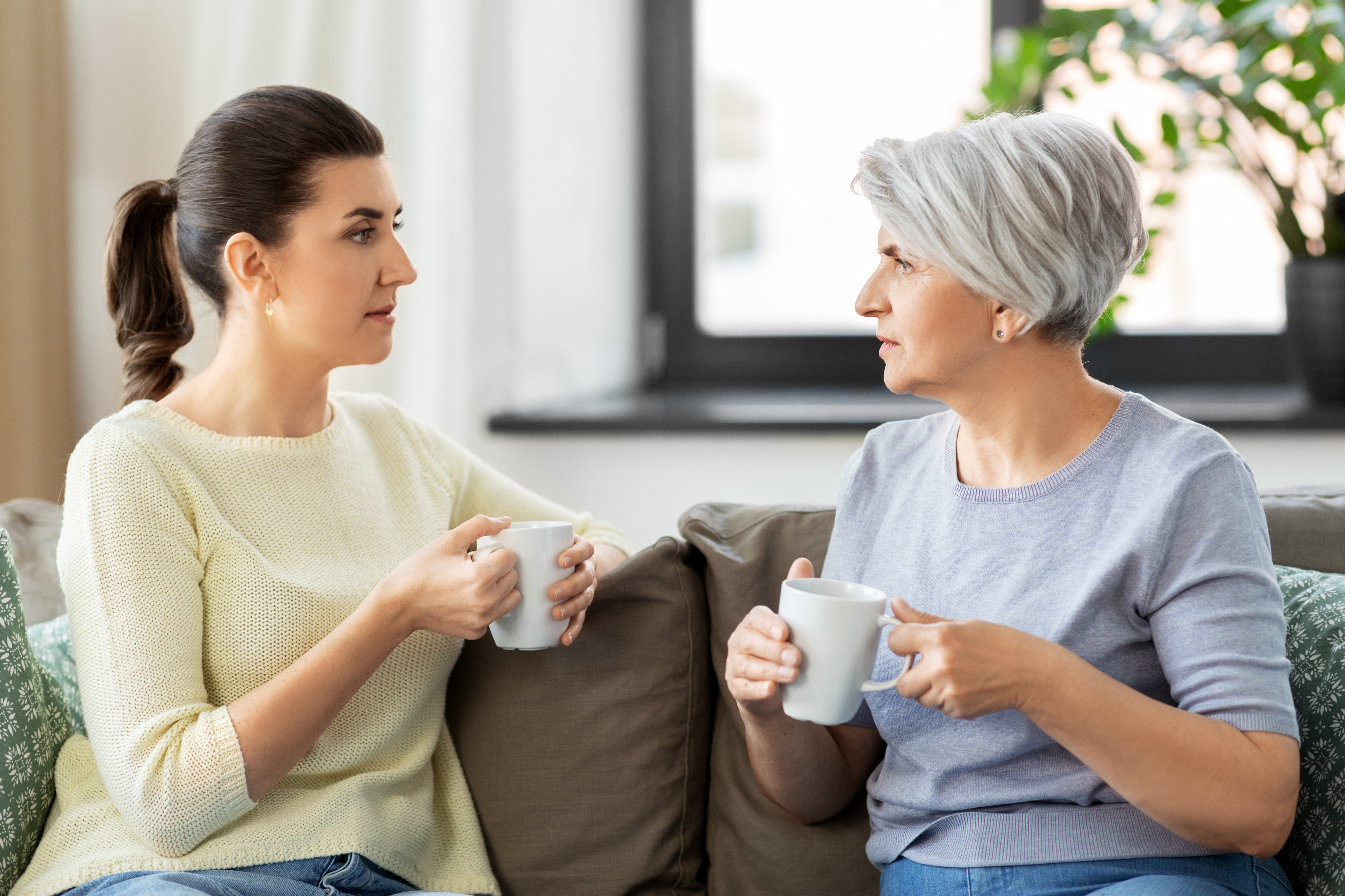 Adult woman talking with mother 