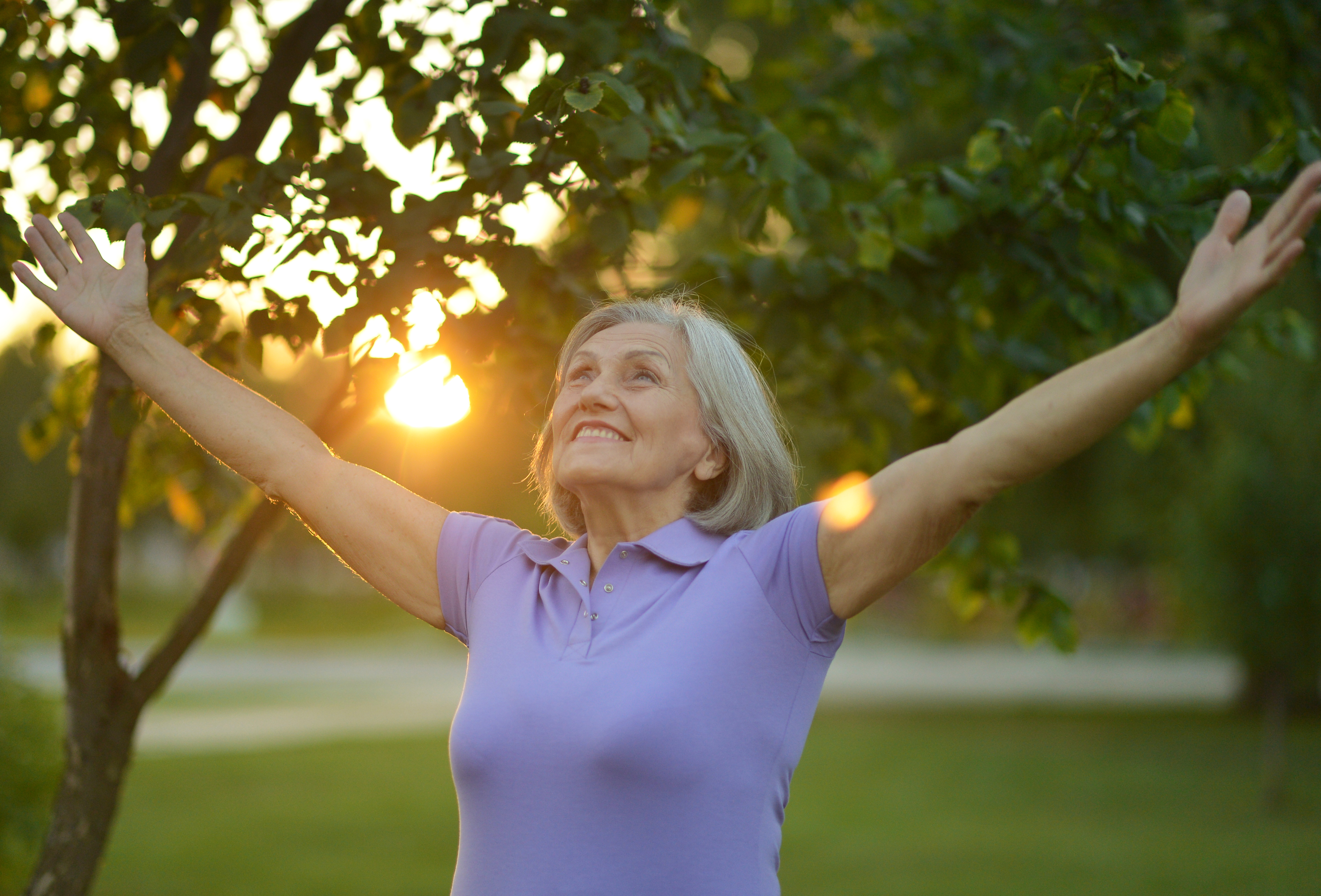 Caregiver starting the day with stretching in the sunshine