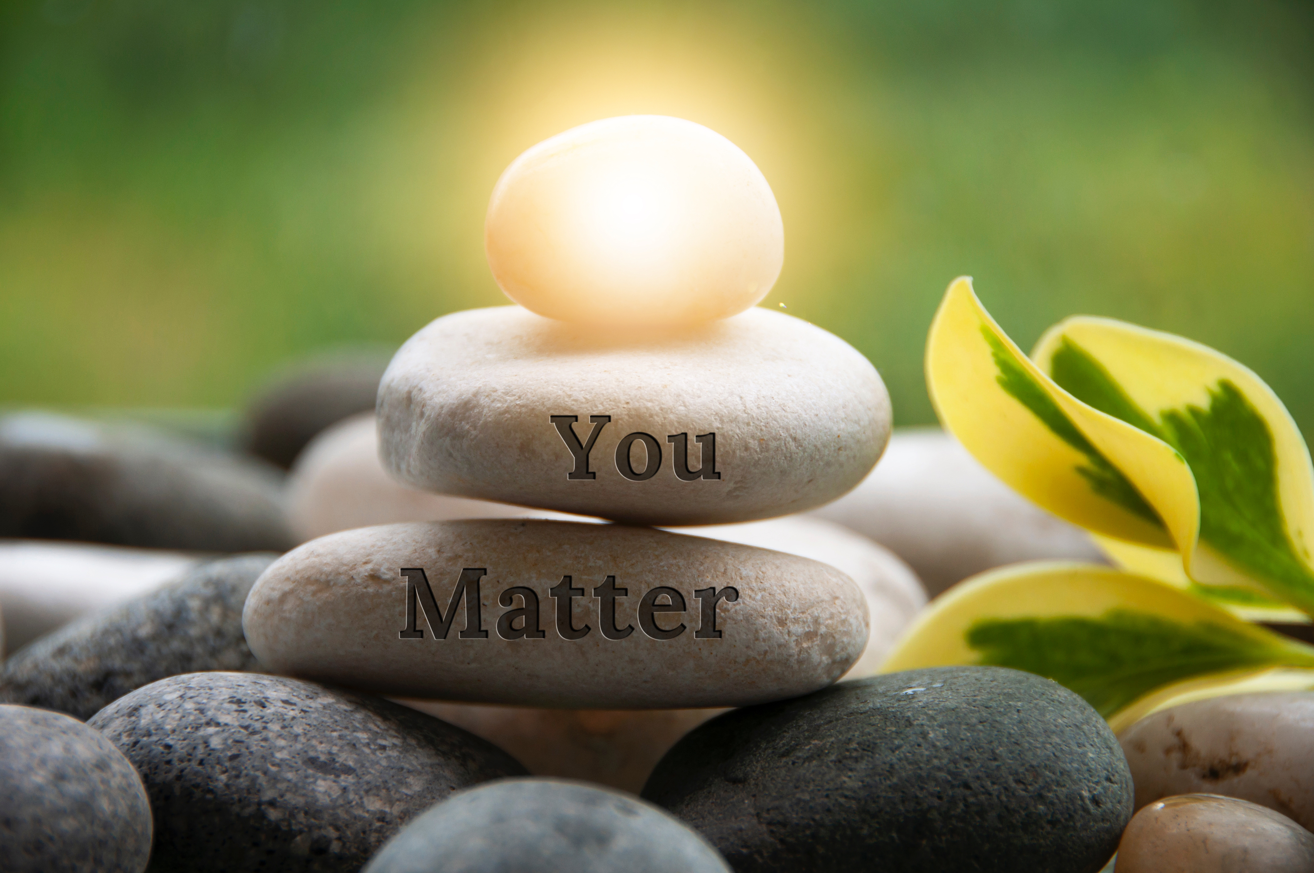 Care for the Caregiver - You Matter Zen Rocks piled artfully with "You Matter" inscribed on one rock and light glowing from the rock on top
