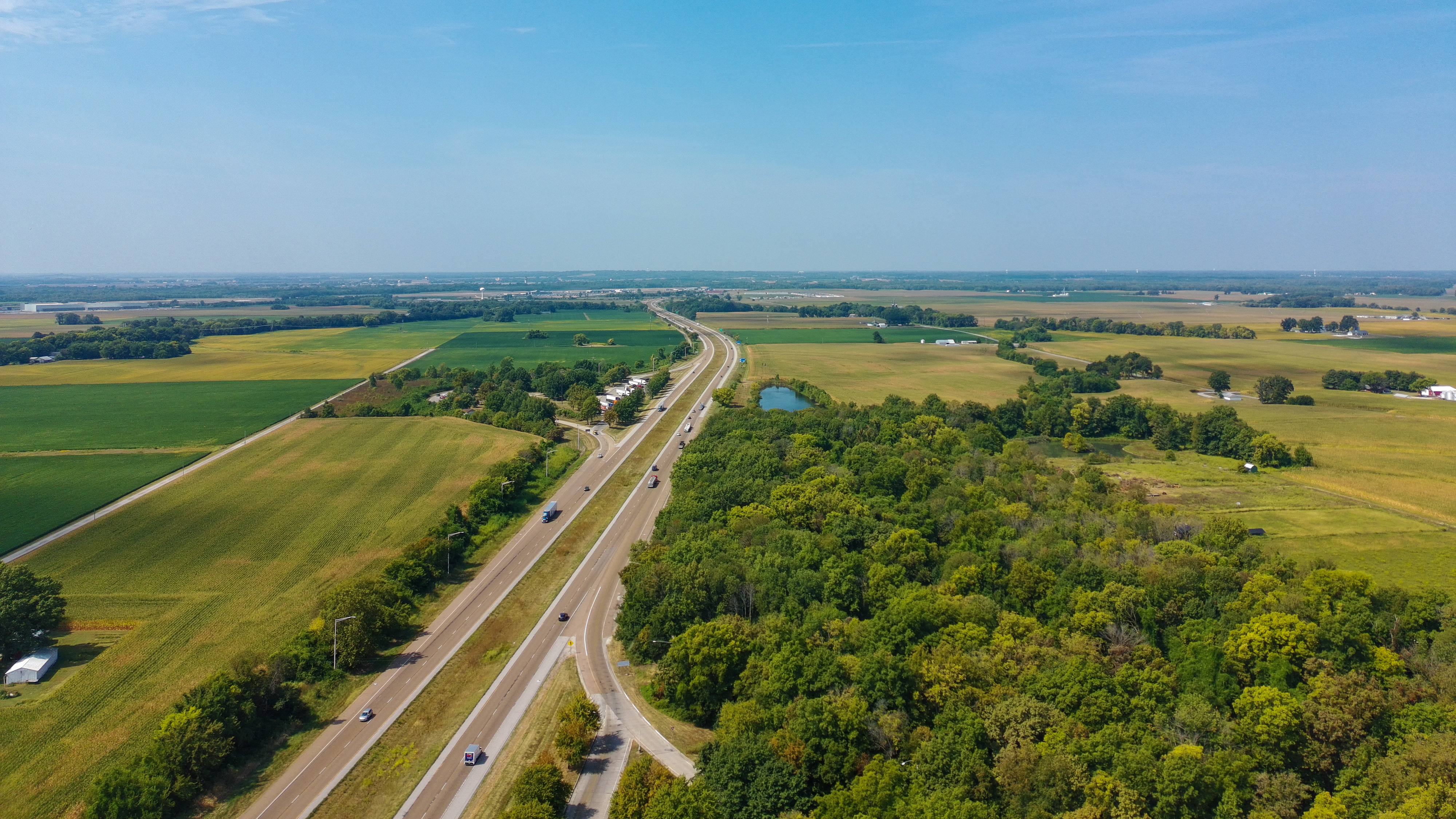 interstate highway in the Midwest showing farms and open fields